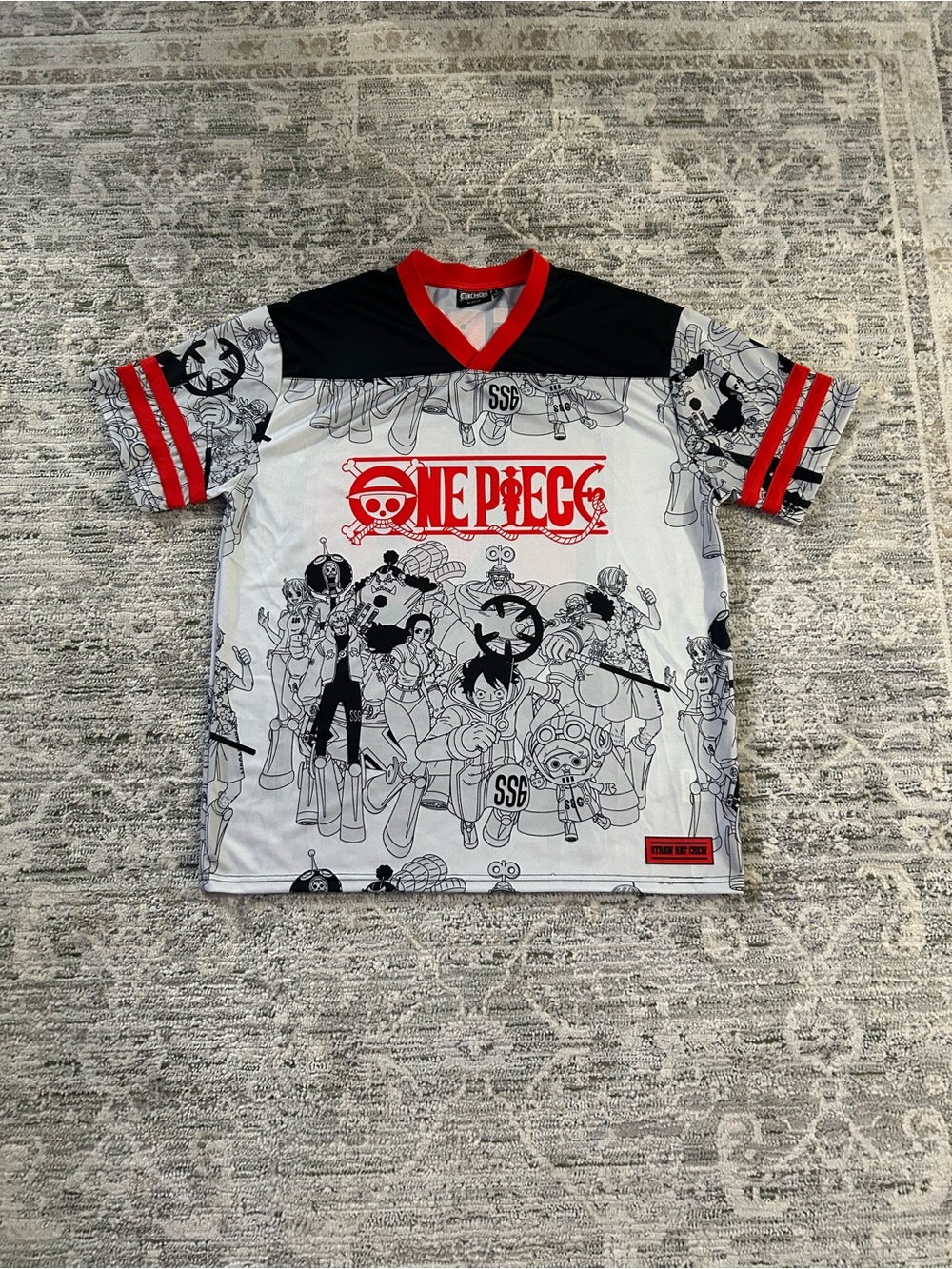 Onepiece White & Black Graphic Short Sleeve Tee with Red Trim